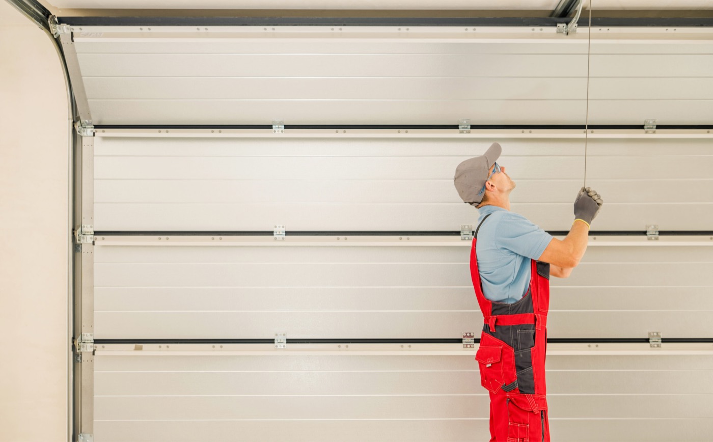 Technician working on a residential garage door